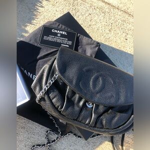 Chanel caviar WOC half moon clutch with silver hardware.